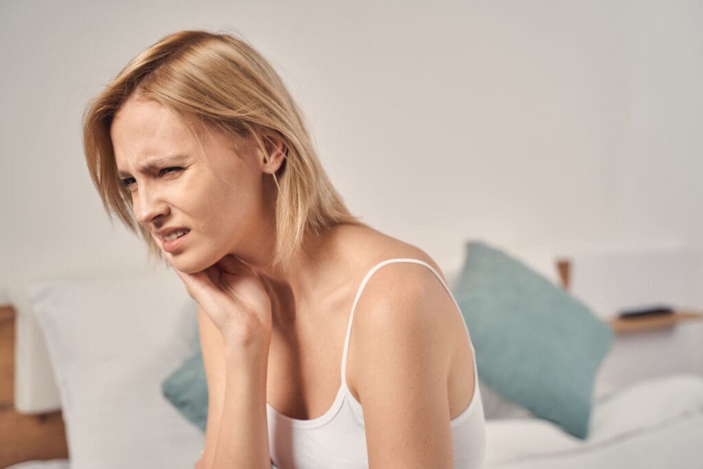 Upset woman having an intense dental pain