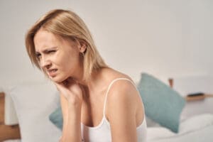 Upset woman having an intense dental pain
