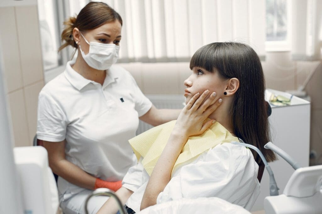 young girl with toothache