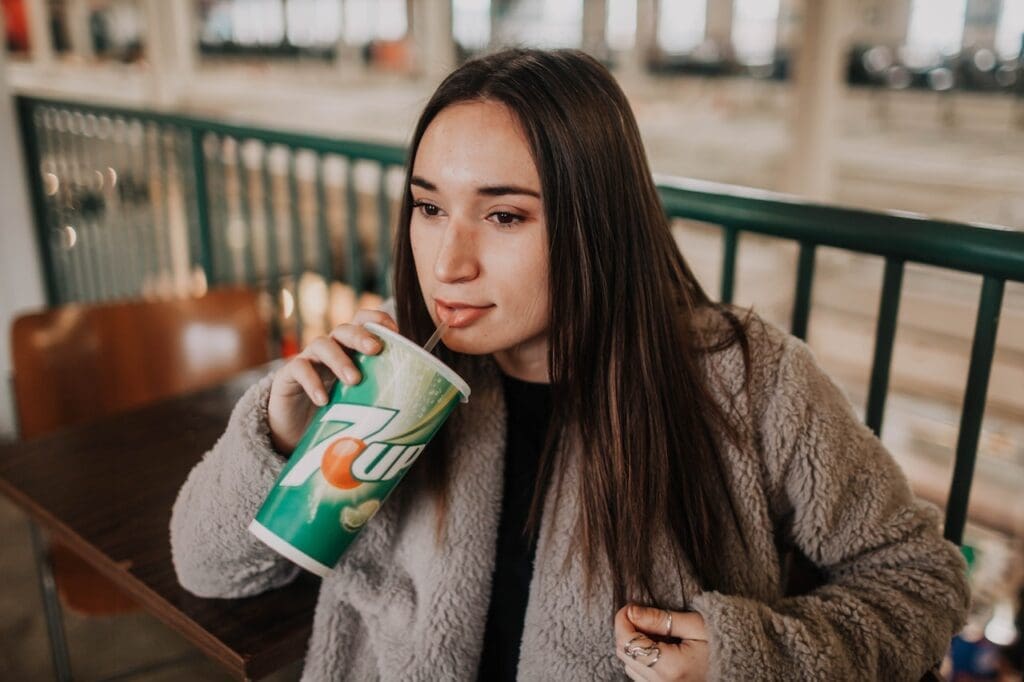 woman drinking soda