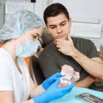 dentist examining a patient during a routine dental check-up.