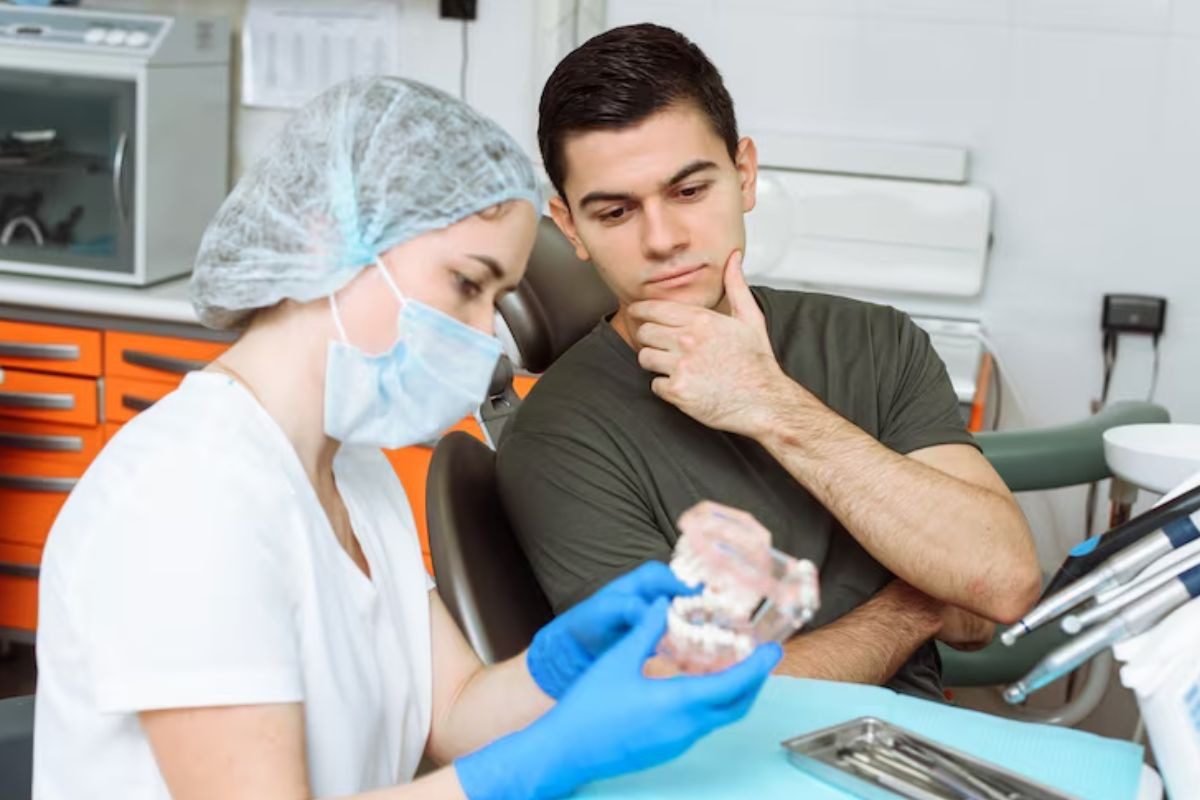 dentist examining a patient during a routine dental check-up.