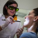 woman receiving smile laser eye treatment